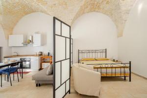 Ένα ή περισσότερα κρεβάτια σε δωμάτιο στο Fuori le Mura