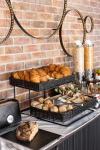 a bunch of different types of bread and pastries at Hôtel Fabric in Paris