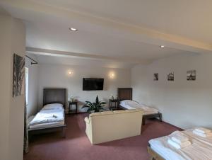 Postel nebo postele na pokoji v ubytování Hotel Antoň