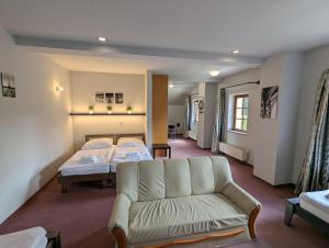 Postel nebo postele na pokoji v ubytování Hotel Antoň