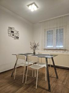 a dining room with a table and chairs at Holiday Home Pampas in Slavonski Brod +7 photos