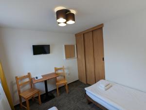 Postel nebo postele na pokoji v ubytování Hotel Antoň
