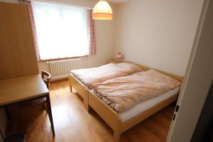 Postel nebo postele na pokoji v ubytování Appartement Mittaghorn Saas-Fee