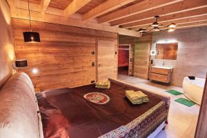 a room with a bed in the middle of a bathroom at Wellness Ferienhaus “Lotus II” in Rieden +21 photos