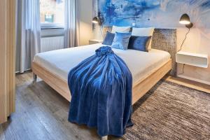 Postel nebo postele na pokoji v ubytování Ferienwohnung Mila EG