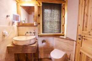 a bathroom with a sink and a toilet at Eifelblockhaus in Rieden