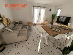 a living room with a couch and a table at Casa di Campara Villa in Neum
