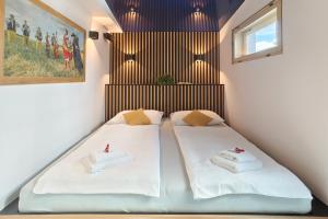 Posteľ alebo postele v izbe v ubytovaní Hotel Zlatá Včela