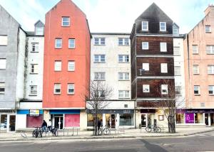 a group of buildings on a city street at The Inver Nest in Inverness