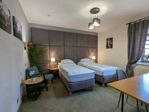 Postel nebo postele na pokoji v ubytování Hotel Antoň + 37 fotografií