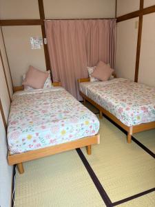Katil atau katil-katil dalam bilik di 大阪三姐妹天下茶屋館 Three Sisters Lodge -Tengachaya
