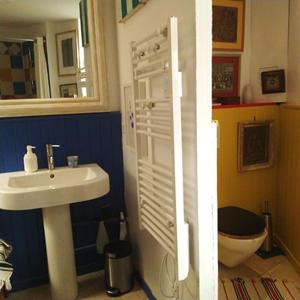 a bathroom with a sink and a toilet at 2 Rue de la Tour in Aniane +12 photos