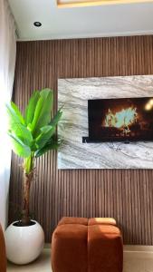 a living room with a couch and a fireplace at Appartement Moderne in Kenitra +11 photos