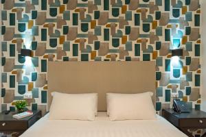 Postel nebo postele na pokoji v ubytování Navona Essence Hotel