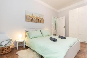 a bedroom with a large bed with two pillows on it at 15 minuti dalla stazione Principe in Genova