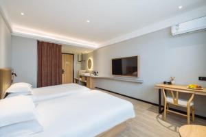 Uma televisão e/ou sistema de entretenimento em Parker Hotel Huangshan Tunxi Old Street Branch