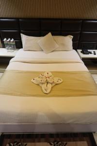 Hotel Hardik Palacio客房内的一张或多张床位