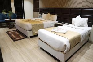 Hotel Hardik Palacio客房内的一张或多张床位