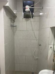 a bathroom with a shower with a toilet and a sink at SUITE Metro SPExpo Airport CPB in Sao Paulo +7 photos