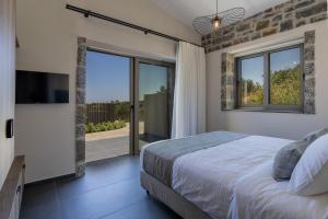 Ένα ή περισσότερα κρεβάτια σε δωμάτιο στο Villa Ioannis - With Private Pool +20 φωτογραφίες