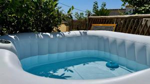 a small pool with blue water in a backyard at The Dream in Massa Lubrense