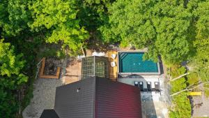 an overhead view of a house with a roof at The ANIMAL - PARTY TIME - POOL SPA AND MOUNTAIN in Saint-Philémon