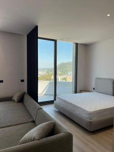 Postel nebo postele na pokoji v ubytování Emera Apartments