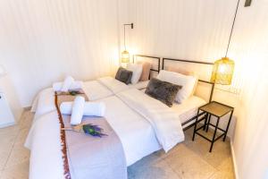a bedroom with two beds with white sheets at Zalihe Boutique Hotel North Nicosia in Nicosia +8 photos