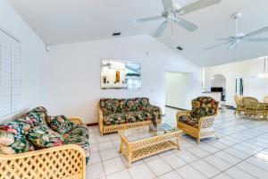 a living room with couches and chairs and a table at Private Dock Waterfront Port Charlotte Oasis! in Port Charlotte