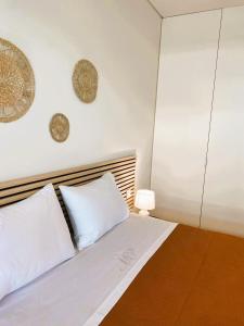 En eller flere senge i et værelse på Beachside Living Gaia Porto by MP