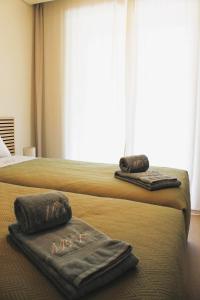 En eller flere senge i et værelse på Beachside Living Gaia Porto by MP