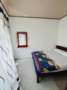 Postel nebo postele na pokoji v ubytování Dilrukshan Holiday Resort