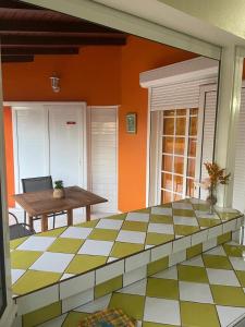 a room with a bed and a table on a patio at Maison avec terrasse à Saint-François - 50 m² avec spa in Saint-François +13 photos