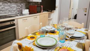 Η κουζίνα ή μικρή κουζίνα στο Dimora Elisa by Ca-Sa Check