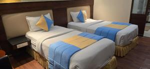 ティルチラーパッリにあるHotel High Pointの2ベッド ホテルルーム 2台付