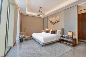 Postel nebo postele na pokoji v ubytování Mandarin Oriental Downtown, Dubai