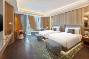 Postel nebo postele na pokoji v ubytování Mandarin Oriental Downtown, Dubai