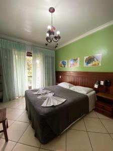 Postel nebo postele na pokoji v ubytování Hotel Casa Encantada
