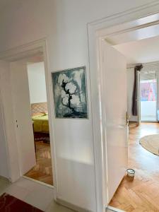 a room with a door open to a bedroom at Center Oasis Retreat in Podgorica