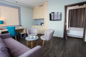 TV a/nebo společenská místnost v ubytování Hotel Regnum Residence