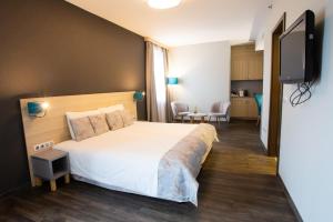 TV a/nebo společenská místnost v ubytování Hotel Regnum Residence