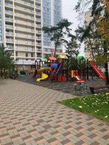 a park with a playground with slides and swings at PREMIUM apartments ЖК Автограф, Институт сердца, МВЦ, Центр серця, Братиславская, Юность, Черниговская, Левобережная, Дарница in Kyiv
