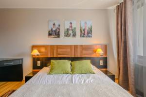 Ένα ή περισσότερα κρεβάτια σε δωμάτιο στο Apartamenty Na Klifie Q4 Apartments