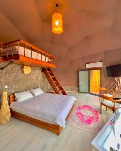 a bedroom with a bunk bed and a staircase at Opia Sapanca Bungalov in Sapanca