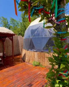 a glass dome on top of a wooden deck at Opia Sapanca Bungalov in Sapanca