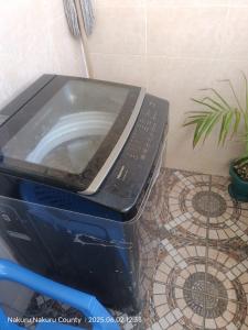 a toaster oven sitting on top of a box at kire homes in Nakuru