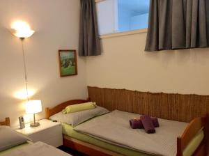 Postel nebo postele na pokoji v ubytování Appartement Planaiblick