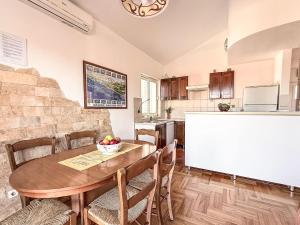 a kitchen and dining room with a table and chairs at Apartment Ananina by Interhome in Rovanjska +29 photos