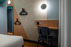 Ibis Budget Guarulhos Aeroporto客房内的一张或多张床位