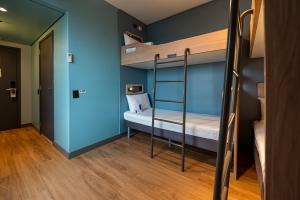 Ibis Budget Guarulhos Aeroporto客房内的一张或多张床位